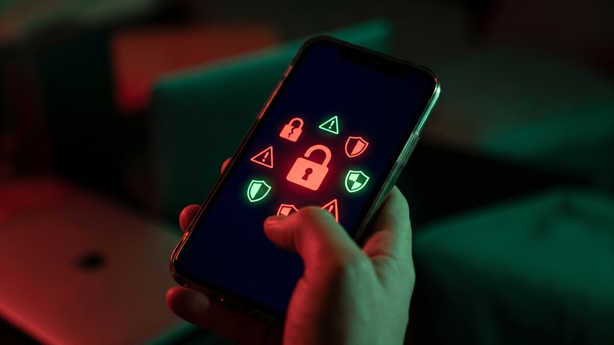 Smartphone displaying security threat warning icons with red and green accent lighting